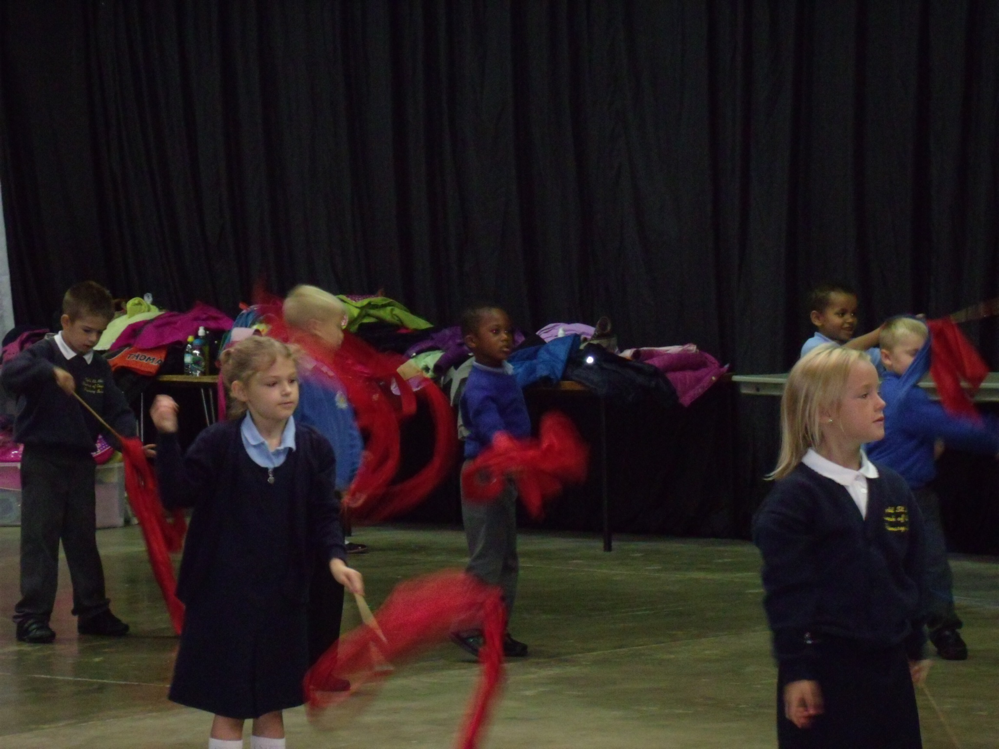 school children learning chinese dancing