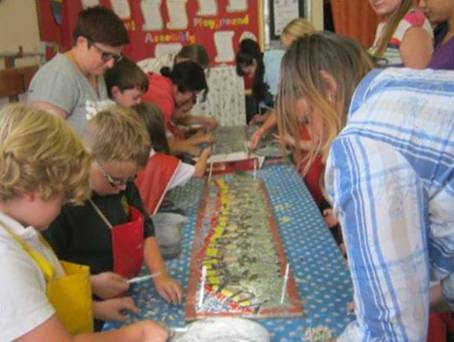 School children creating a mosaic